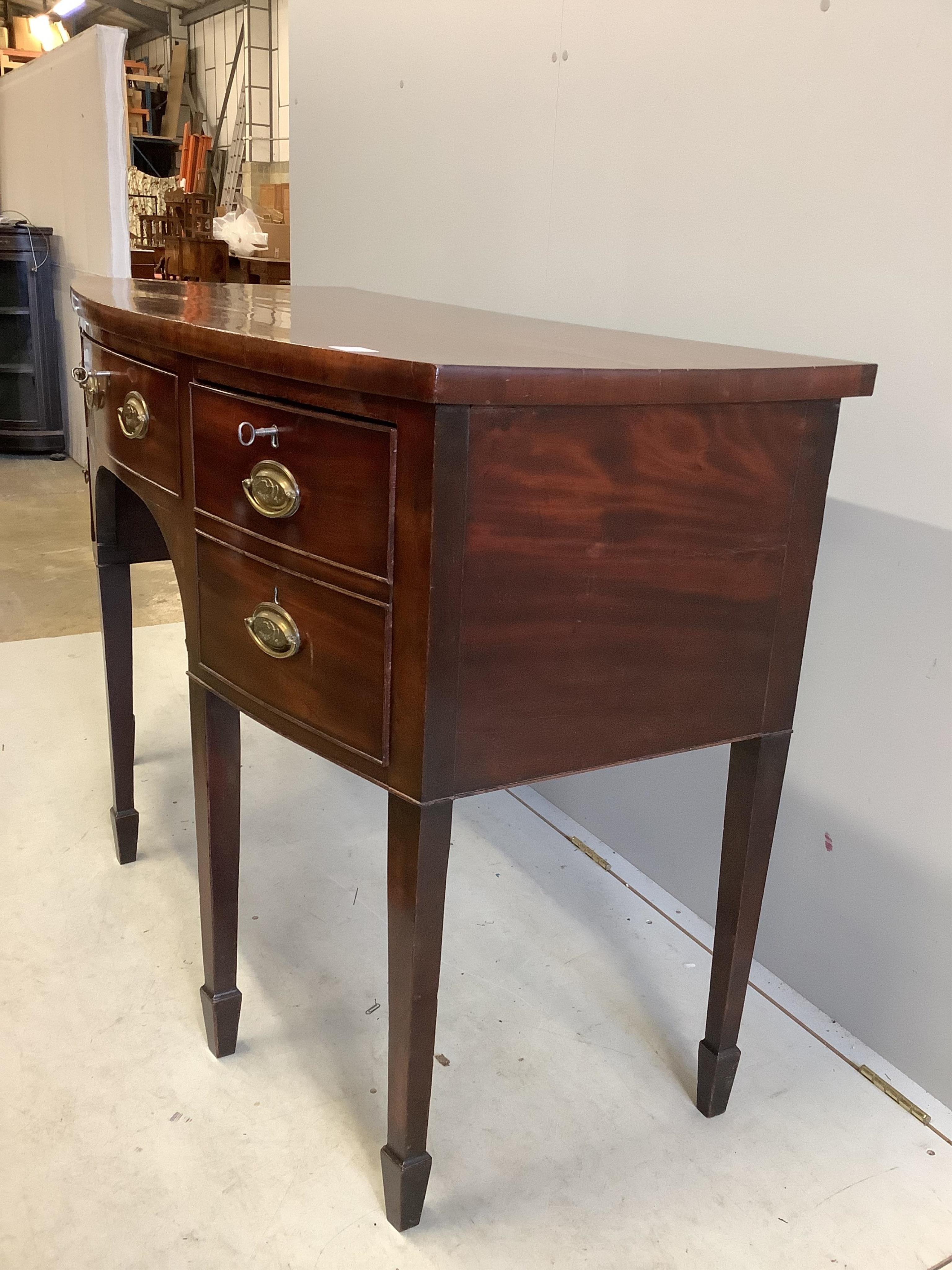 A George III mahogany bow front sideboard, width 136cm, depth 62cm, height 93cm. Condition - fair